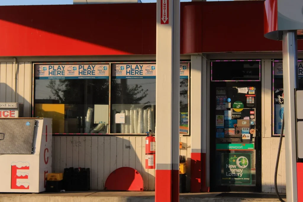 Convenience store and gas station front with lottery signage in New Jersey